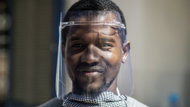 Idrissa Sall demonstrates a protective face shield made with a laser cutter, to be used to protect against transmission of the coronavirus, at the FabLab workshop at the Ker Thiossane multimedia centre in Dakar, Senegal. 