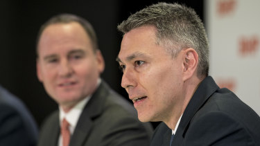 BHP head of Australian operations Mike Henry (right) has won the race to become the mining giant's new CEO. 