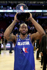 Kawhi Leonard with the Kobe Bryant MVP award after the 69th NBA All-Star Game.