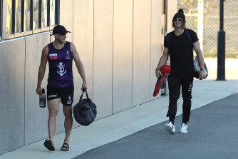 Nat Fyfe (right) arrives at Fremantle to resume training in groups.