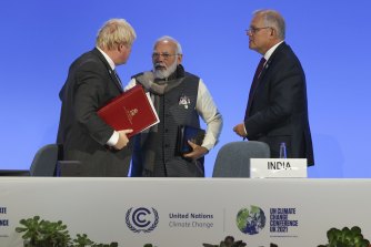 Boris Johnson said the decarbonisation pledge from India’s Narendra Modi, seen here with Johnson and Scott Morrison, is one of the most significant wins of COP26. 