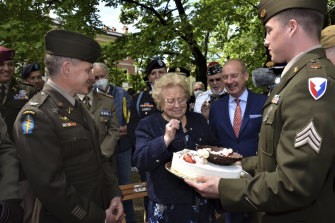 La dolce vita: US soldiers present a birthday cake to Meri Mion in Vicenza, northern Italy.