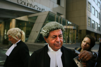 Con Heliotis talks to the media in March 2006 after Mokbel, his client, failed to show up to court. Ms Gobbo is pictured in the background.