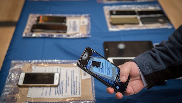 Encrypted smartphones held as evidence by the New York City Police Department on display in 2016.