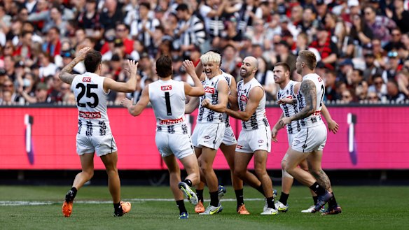 Jack Ginnivan celebrates a goal in front of the Collingwood faithful.
