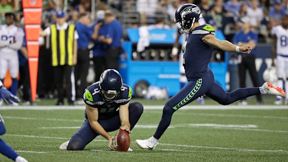 Impact: Seattle's Jason Myers kicks a field goal as punter Michael Dickson holds the ball.