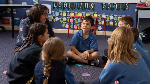 Woollahra Public School students with principal Nicole Molloy.