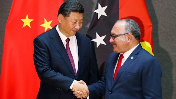 Papua New Guinea's Prime Minister Peter O'Neill shakes hands with Xi Jinping on Friday.