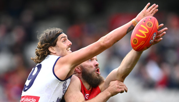 Luke Jackson, pictured against his ex-captain Max Gawn, is thriving as a Docker.