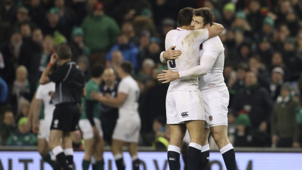 Joyous: Ben Youngs embraces teammate Elliot Daly (right) after the upset victory against Ireland in Dublin.