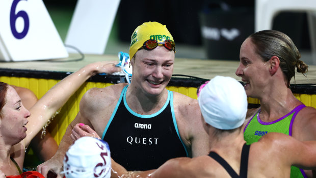 Cate Campbell of Queensland is embraced by her competitors after competing in her final race.