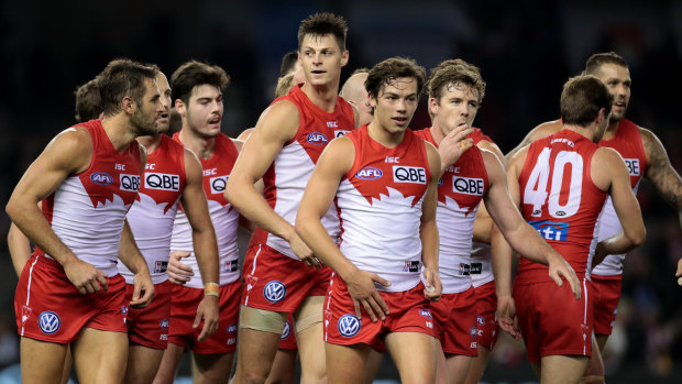 Sharing the load:  The Swans celebrate one of ruckman Callum Sinclair's three goals against St Kilda.