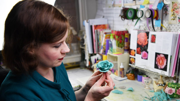 Hannah Poppins is relisting the paper flowers as blue turquoise.