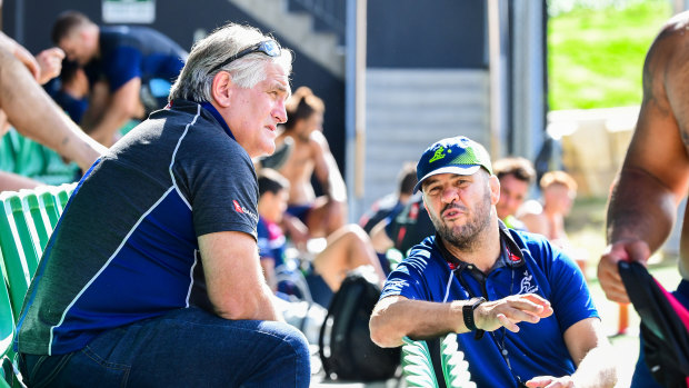 Scott Johnson (left) and Michael Cheika chat during a Wallabies training session in July 2019.