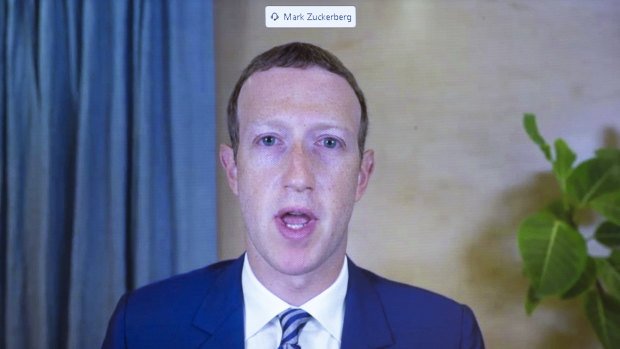 Facebook CEO of Mark Zuckerberg appears on a screen as he speaks remotely during a hearing before the Senate Commerce Committee on Capitol Hill.