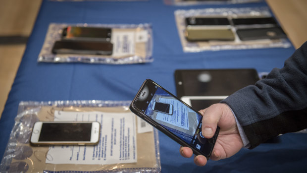Encrypted smartphones held as evidence by the New York City Police Department on display in 2016.