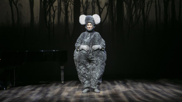Mandy Bishop looked so cute and sad in a big fat koala suit before a backdrop of charred gum trees that a collective sigh of sympathy passed around the room.