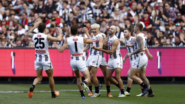 Jack Ginnivan celebrates a goal in front of the Collingwood faithful.