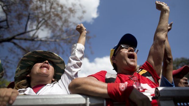 Supporters of Venezuela's President Nicolas Maduro cheer during a government rally in Caracas, Venezuela, on Saturday.