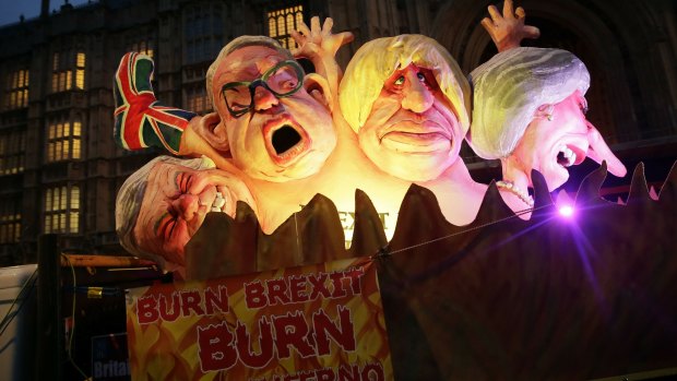 "Burn Brexit Burn": Anti-Brexit protesters show effigies of Michael Gove, Boris Johnson and Theresa May.