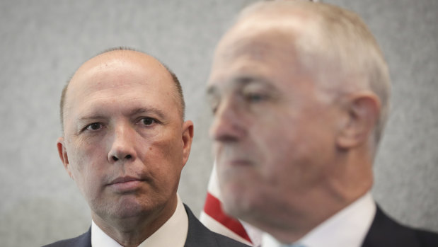 Peter Dutton and Prime Minister Malcolm Turnbull. A series of ministerial resignations will leave many government agencies in a holding pattern.