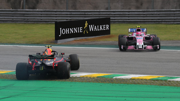 Off-roading: Max Verstappen and Esteban Ocon sit off-track after coming together.