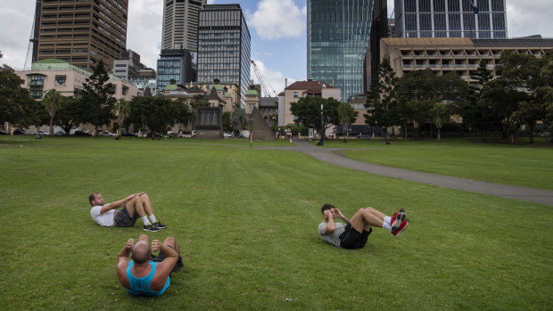 People exercising at the Domain as gyms have closed due to the COVID-19 pandemic.
