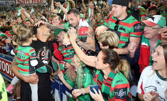 Crowning glory: Sutton and Souths fans celebrate the club's drought-breaking grand final win 2014.