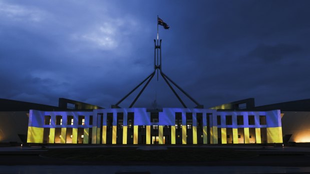 Parliament House in Canberra lit up on Monday evening in a show of support for Ukraine. 