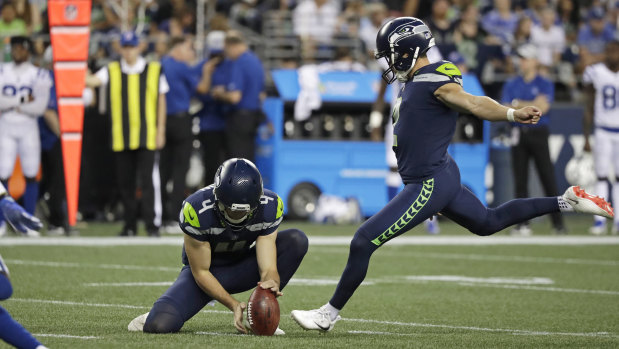 Michael Dickson holds the ball for Seattle field goal kicker Jason Myers during the pre-season.