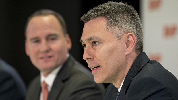 BHP head of Australian operations Mike Henry (right) has won the race to become the mining giant's new CEO. 