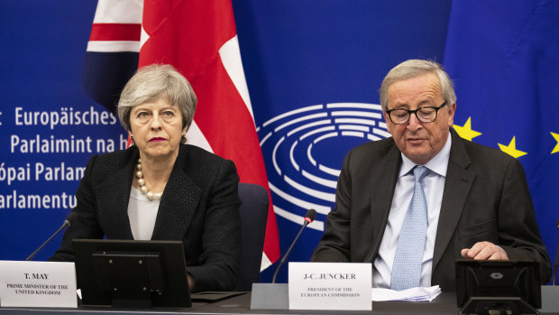Theresa May listens as Jean-Claude Juncker, president of the European Commission, speaks after their meeting in Strasbourg, France.