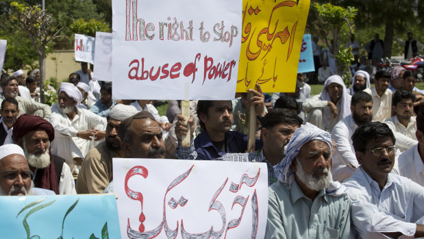 Protesters at the site of the fatal accident involving the military attache in Islamabad.