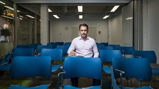 Ben Bonjean, director of English First's Australia operations, sits in an empty classroom at the company's Sydney college, which has six students. 