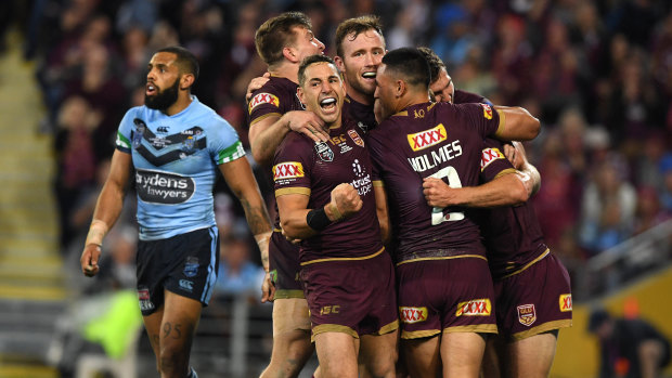 Billy Slater leads celebrations after Daly Cherry-Evans' match-winning try.