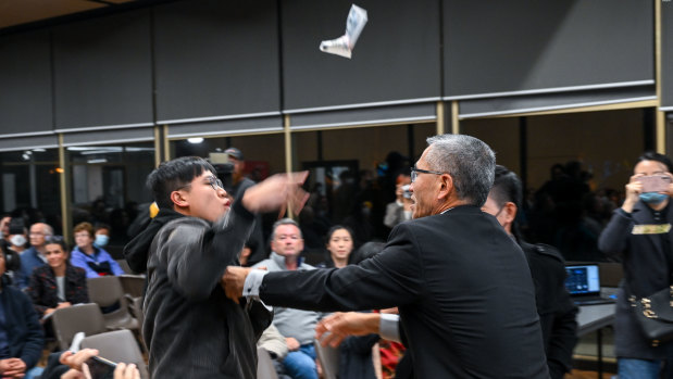 Protesters at the Chisholm candidates’ forum.