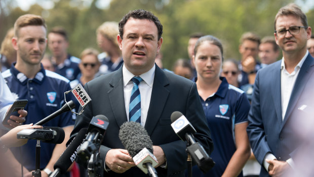 Moving out: NSW Sports Minister Stuart Ayres speaks to the media alongside Cricket NSW CEO Andrew Jones.