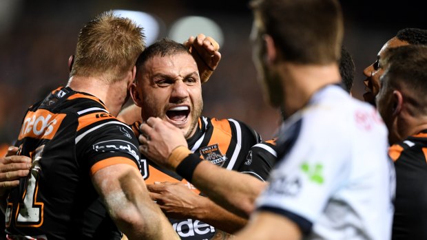 Stampede: Robbie Farah and the Tigers hammer the Cowboys.