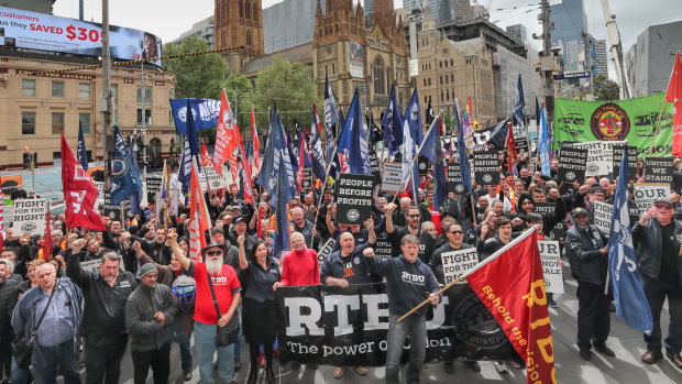 Rail workers rally outside of Flinders Street during bitter dispute with Metro for better pay
