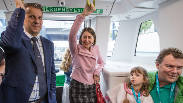 Transport Minister Andrew Constance and Premier Gladys Berejiklian ride the first regular metro service on Sunday.