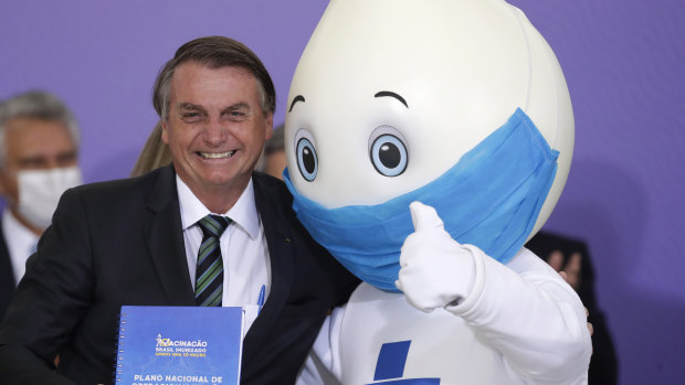 Last seen in December: BrazilIan President Jair Bolsonaro poses for photos with the mascot of the nation’s vaccination campaign, named “Ze Gotinha”.
