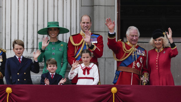The royal family greeting the crowd from the balcony of Buckingham Palace after the Trooping The Colour parade last year.