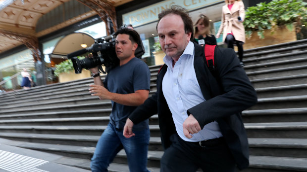 Reinier Jessurun (right) runs from court after his sentencing hearing this week.
