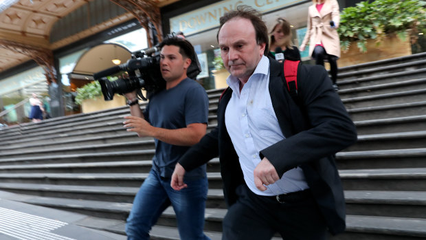 Reinier Jessurun (right) runs from court after his sentencing hearing on Thursday.