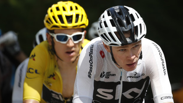 Defending champion Chris Froome, right, and Geraint Thomas, wearing the overall leader's yellow jersey, climb Montee de Peyragudes pass.
