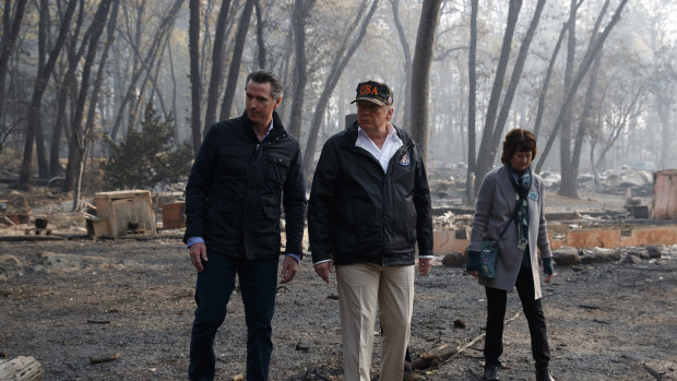President Donald Trump talks with California Governor-elect Gavin Newsom and Paradise Mayor Jody Jones during a visit to a neighbourhood destroyed by the wildfires, on Saturday.