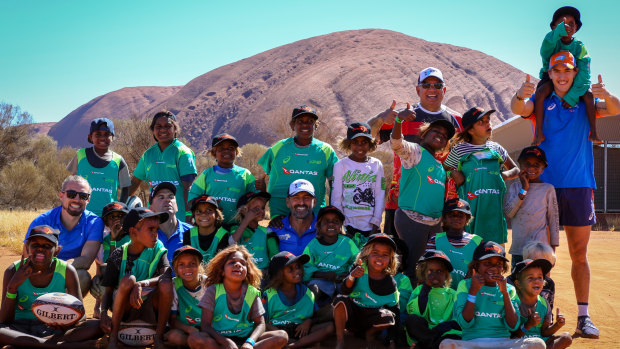 Young Indigenous kids try their hand at rugby at Uluru.