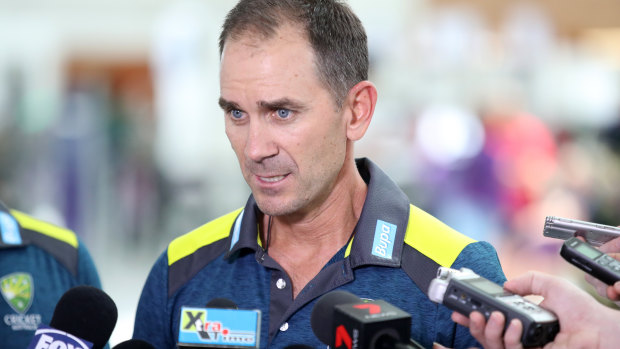 Justin Langer speaks to media at Adelaide Airport before flying to Perth for the second test against India,  