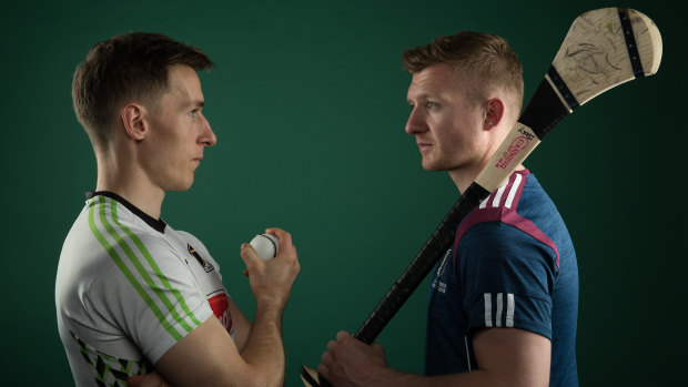 Kilkenny's Cillian Buckley faces off against Galway's Joe Canning.