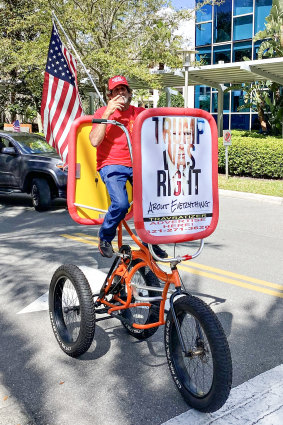 A Trump supporter on a tricycle at the Conservative Political Action Conference (CPAC) in Orlando, Florida. 